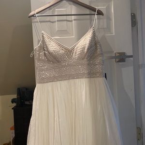 Sleeveless beaded dress. Makes a great honeymoon or unconventional wedding dress